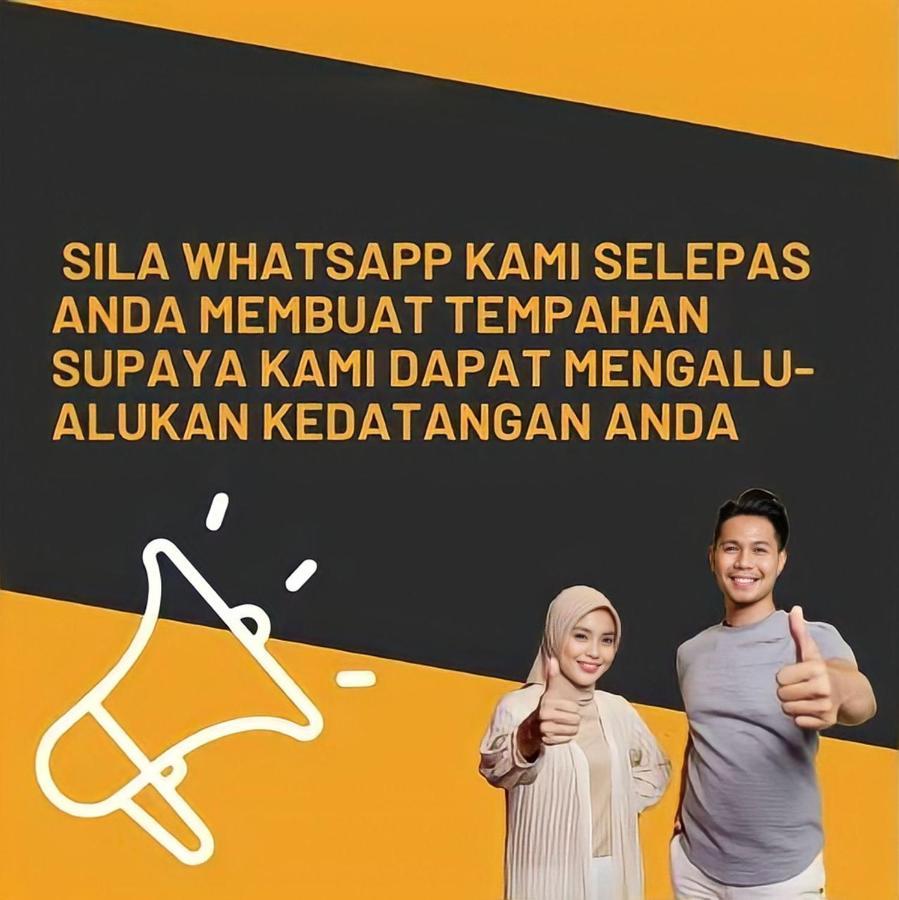 Sinar Rasa Homestay At I-Soho, I-City ชาห์อาลัม ภายนอก รูปภาพ A poster from the National Security Council of Malaysia, asking people to stop spreading fake news via WhatsApp.